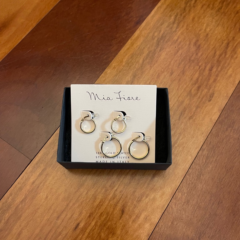 Two pairs of gold hoop Mia Fiore earrings